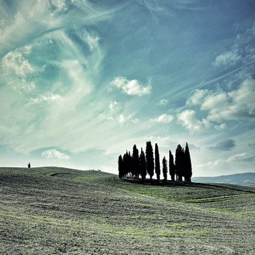 ValD’orcia, a region in Tuscany where massive rolling hills and lines of cypress trees form breathtaking scenery.