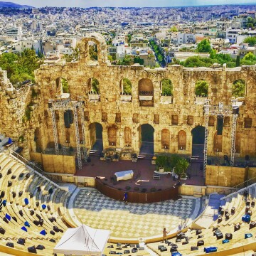 This was shot from the top of Acropolis in Athens, Greece. This magnificent gigantic structure is the ancient amphitheater of Acropolis. In the backdrop is the city of Athens and the beautiful architecture takes you back to the history. This masterpiece I had to capture it. 