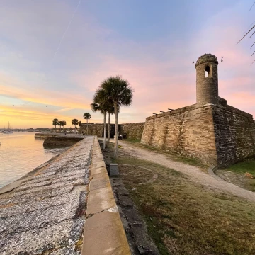 Dawn casts pastels colors across the sky over the Castillo de San Marcos fort in St Augustine, a beautiful and historic town in Northern Florida.