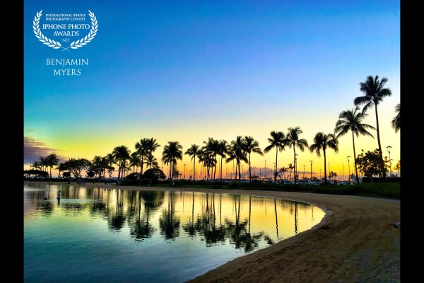 This shot was taken while walking around the lagoon at the Hilton Hawaiian Village, a favorite place to watch the sunset. I’ve always been a fan of reflections, especially in calm water. 