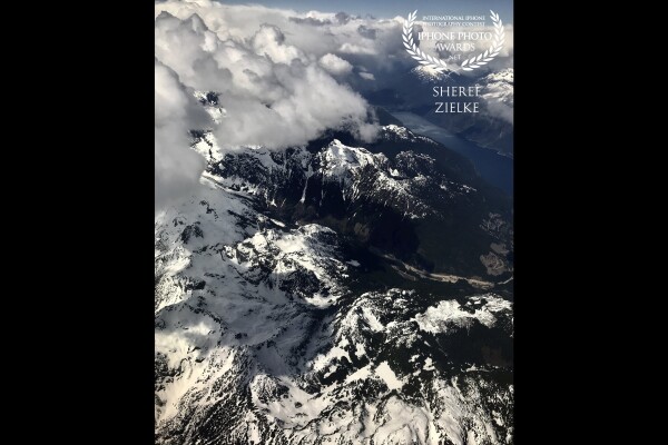 Grabbing a window seat when flying over the Rockies westward to Vancouver Island is so rewarding. I love the contrast and textures in this image. Keeping the lens close to the window helped to avoid reflections. 