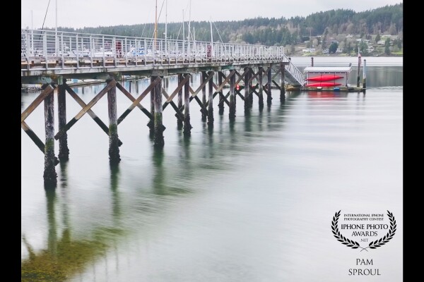 “Dock kayak sea view” -2021.<br />
This silver morning light on Liberty bay in the beautiful Pacific Northwest in Poulsbo WA. The red kayaks against the soft silver light caught my eye and makes me smile when I see this image.