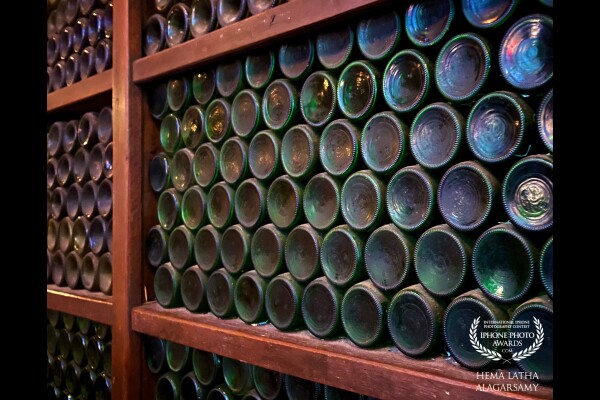 Que Pasa, 7 Emerald Hill, Singapore. A makeshift wall in a bar, decked with empty bottles. I’d like to think that each and every green bottle there is sealed with beautiful memories of those who sipped wine, shared great company and wonderful laughter around the table.