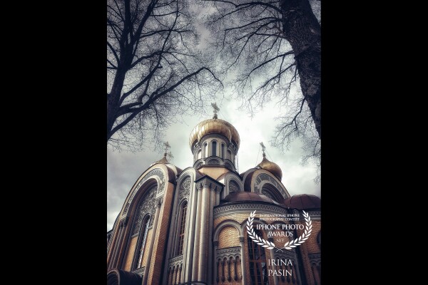 A beatiful orthodox church in my hometown Vilnius. The gloomy day and the trees created a special atmosphere when I was passing by. I looked up and could not resist taking this shot.