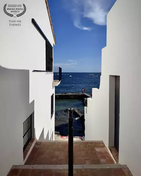 Maritime stairs down to the beach Platja de Port Bo in Calella de Palafrugell, Costa Brava, Spain.
