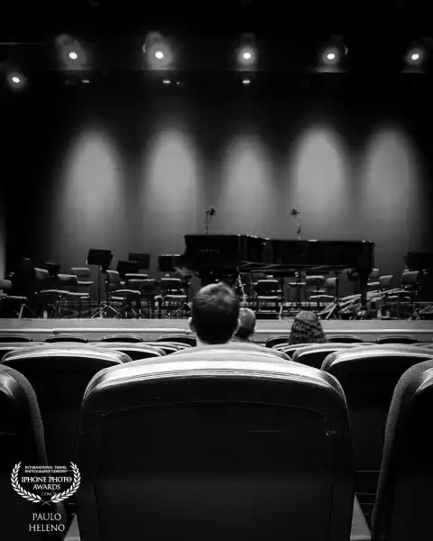 Waiting for a concert to start.