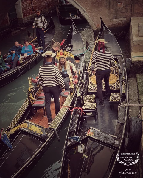 Venice Gondola men and their tourists.