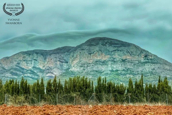 On a very rainy day we drove back home from Spain. When I saw these clouds behind the hills a had to take a photo, so we stopped the car at a save place.