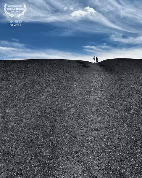 “Catching Our Breath” <br />
A couple pausing after climbing a cinder cone at Craters of the Moon National Monument in Idaho.