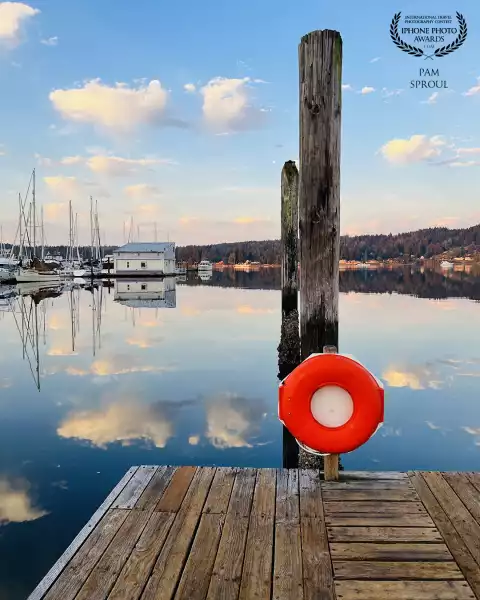 The floating cloud reflections against the weathered dock and fall colors in the distance ~ beauty in nature<br />
“Cloud reflections at Oyster Park”-2024