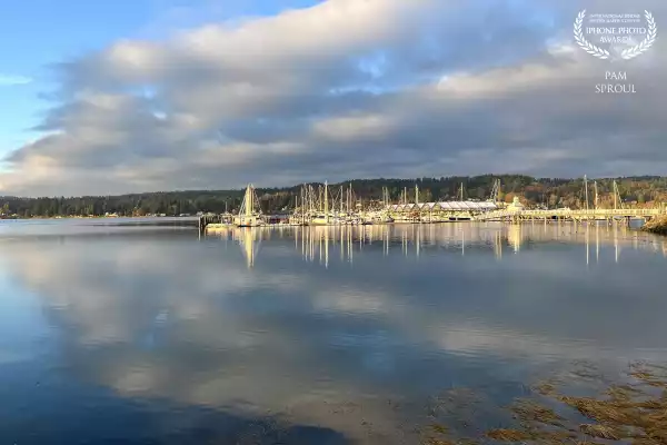 Beautiful dramatic light reflecting off the bay astounds the eyes while breathing in the saltwater soothes the soul <br />
<br />
“Golden hour sunrise Liberty Bay”