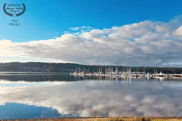 I was so impressed by the dramatic  clouds tapering around and reflecting off of the boats ~ thankful for my iPhone 📱 <br />
<br />
“Cloud frame Liberty Bay” -2025