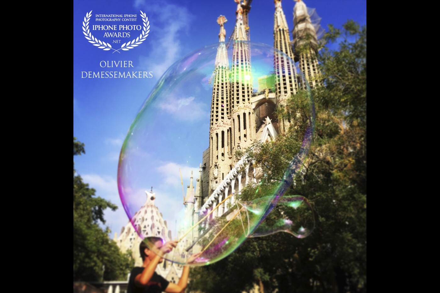 This picture was taken in Barcelona, Spain. The guy who was making these huge bubbles gave me the perfect decor to shoot Gaudi’s Sagrada Familia.
