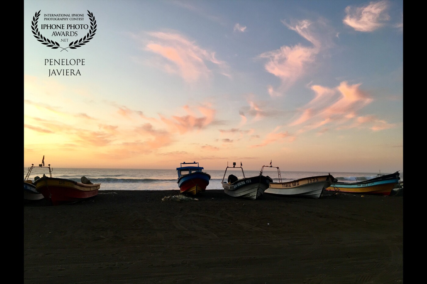 Boats at sunset in fishermen’s cove Rinconada-Cobquecura, Chile, where you can enjoy seafood extracted from the sea and converse whit fishermen.