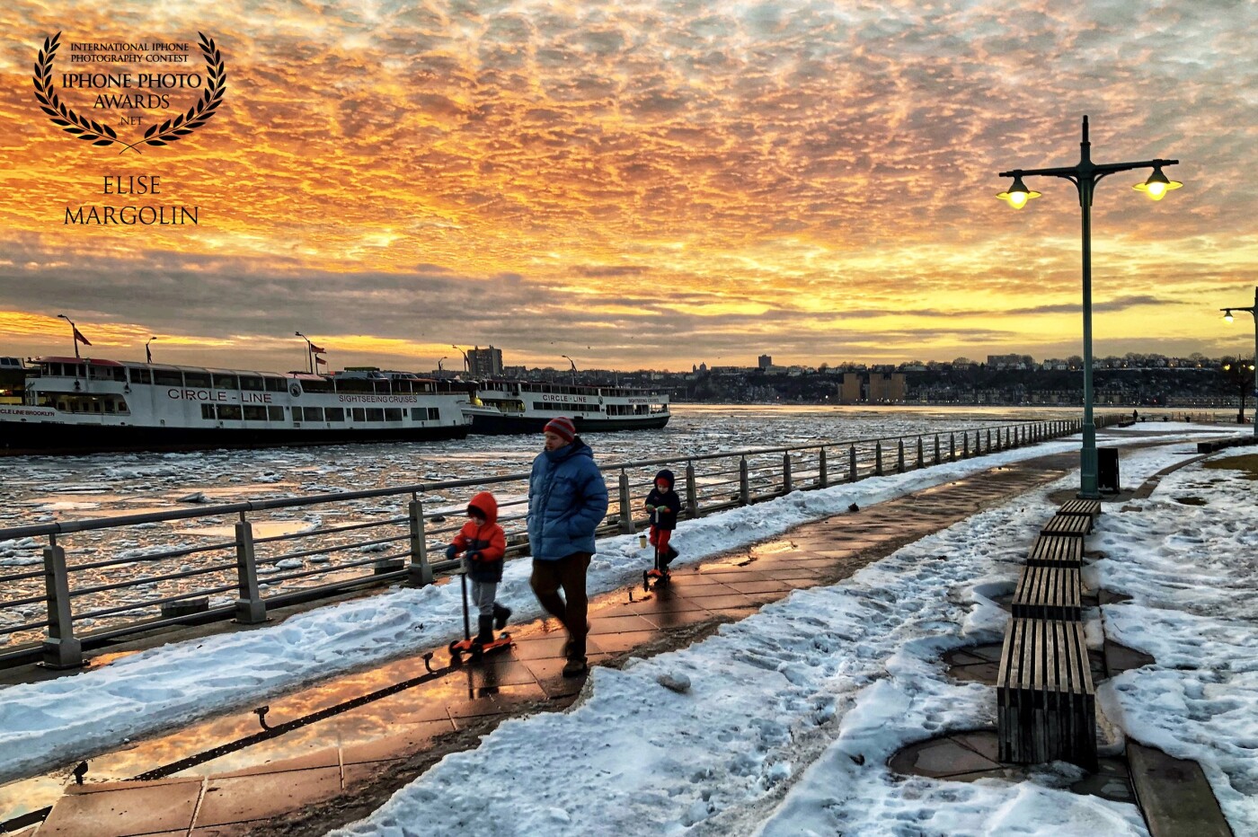 A simple family stroll along the New York City's Hudson River more often than not will always lend itself to a beautiful winter colored sunset. 