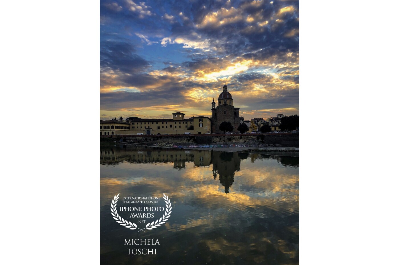 The church of San Frediano in Cestello in the Oltrarno district in Florence. Above it the sky that is preparing for the sunset. Below, its reflections in the Arno. <br />
An impromptu shot during a walk along the opposite bank of the river.