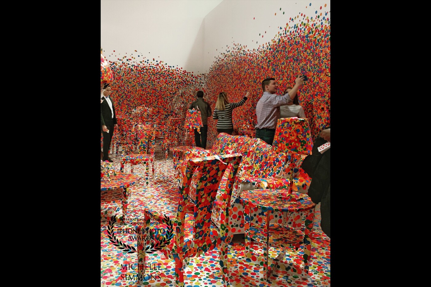This photograph was taken in the last room of the great Yayoi Kusama Infinity Mirrors exhibition at the Atlanta High Museum. Before entering the last room, museum-goers are given a small page of sticky polka dots to place wherever they please. As you can see from the photo, this was taken after the exhibit had been running for several weeks. It was a great interactive experience. 