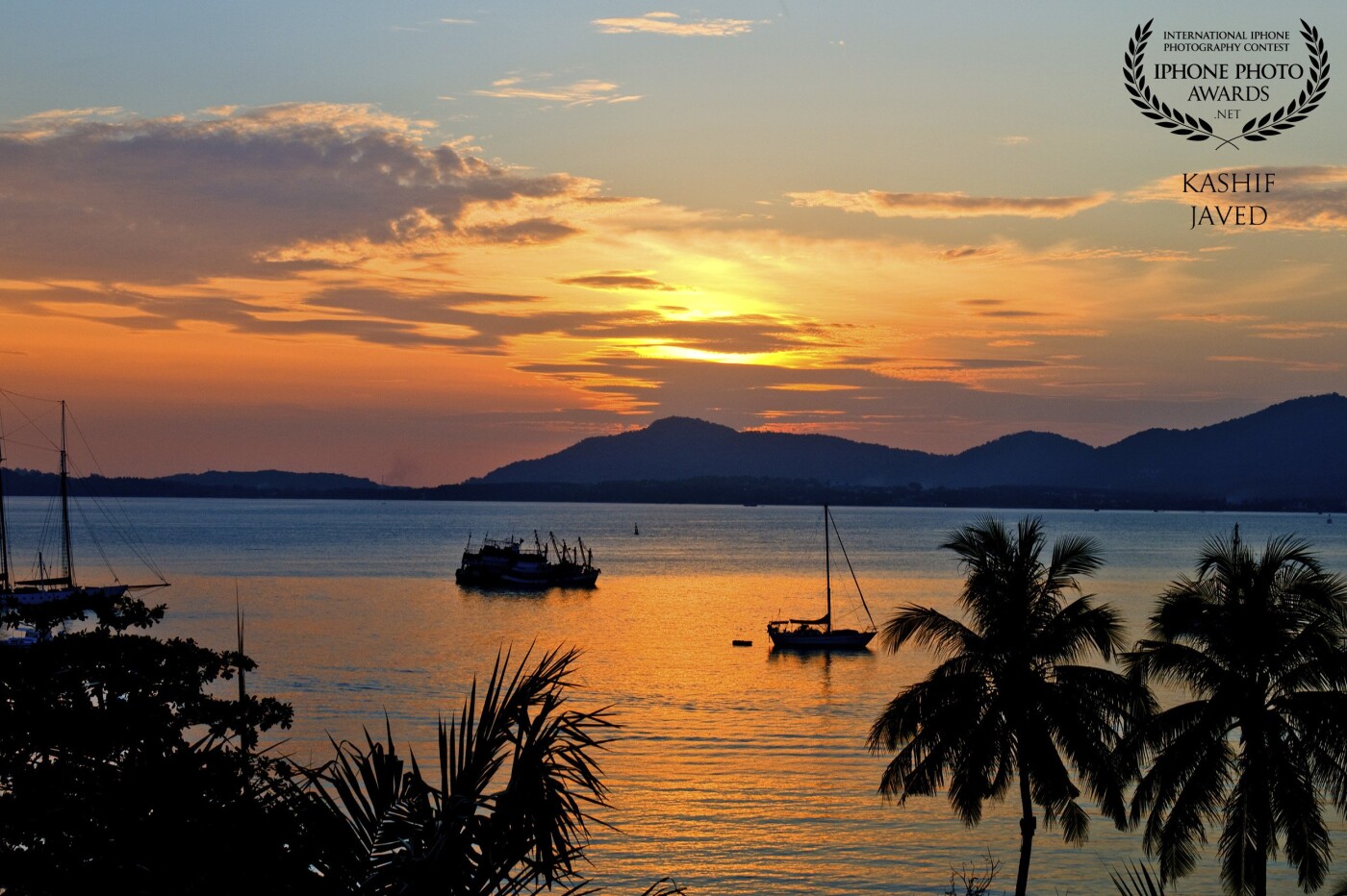 I took this photo at Phuket – Thailand, this spectacular view from resort balcony was just waiting to be captured. I still remember checking into the room, opening the balcony door first thing and scrambling to capture this beautiful sunset<br />
<br />
‘There are some things you learn best in calm, and some in a storm.’ – Willa Cather
