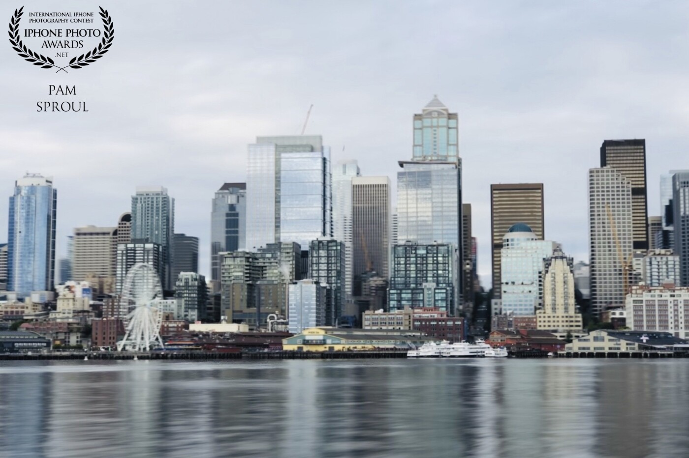 Seattle waterfront view from the stern of the Seattle-Bainbridge Island Ferry ~ slightly shimmering in the light <br />
“soft Seattle view” 2019