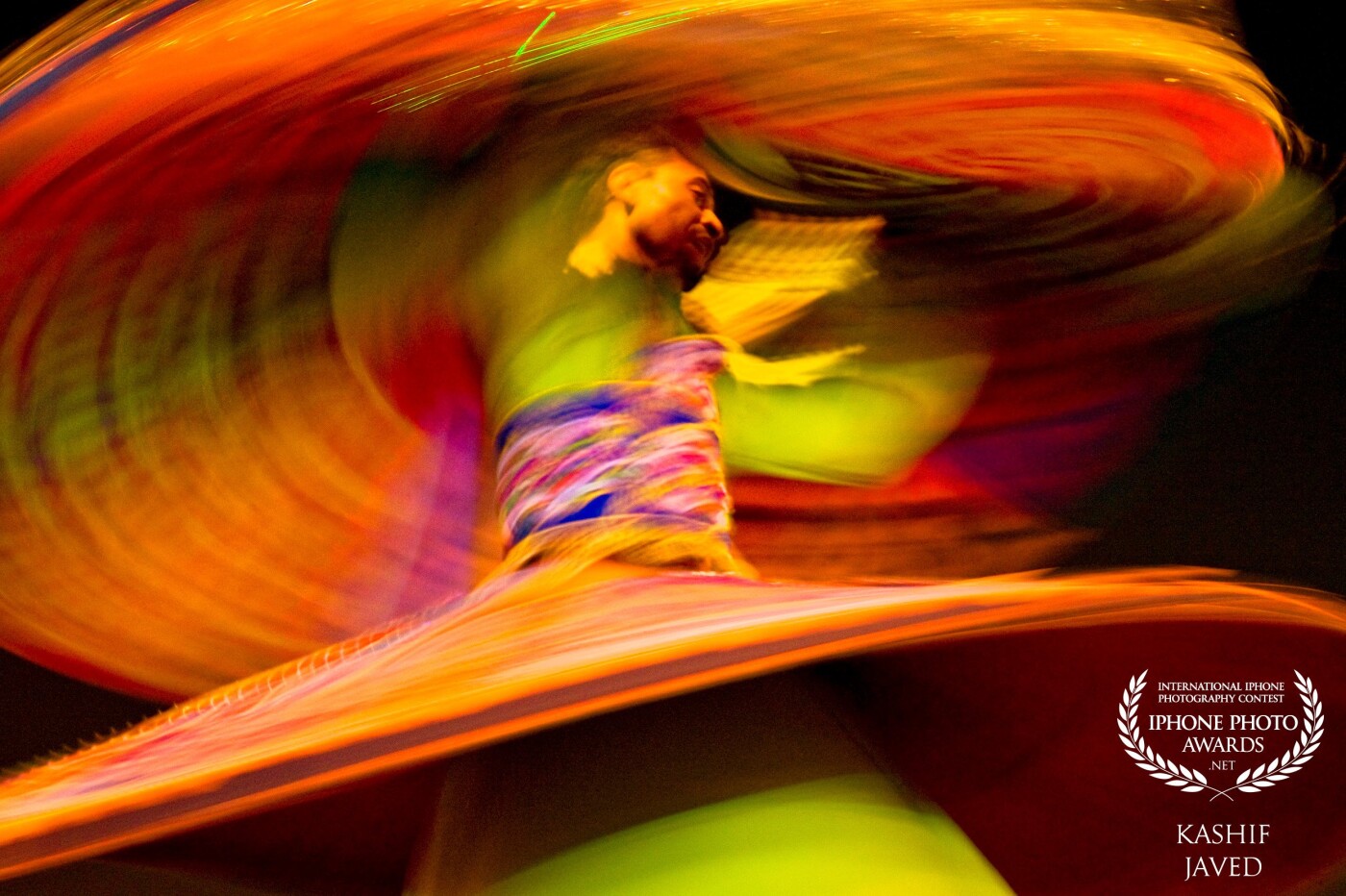 I took this photo at a festival in Dubai, skills of this Egyptian dancer along with his colorful costume were amazing. I was lucky to find a good viewing point to capture this beautiful moment. 'Compromise in colors is grey.’ ― Edi Rama