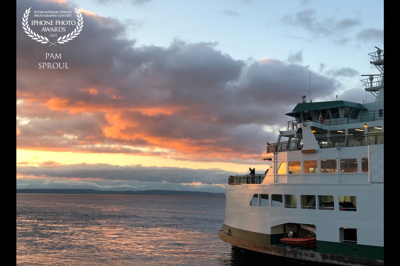 A beautiful happenchance~ ferries passing on the Puget Sound~ the gorgeous clouds and color ~ my iPhone to attempt to capture the beauty of the moment<br />
Ferry light sunset.