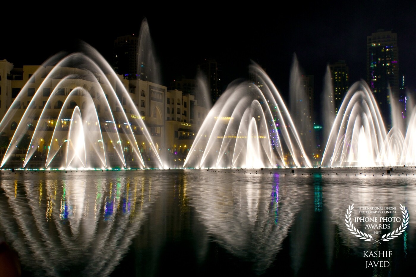 I took this photo during my stay in Dubai – UAE, a famous and popular fountain spectacle at Dubai Mall. The water dance along with its reflection is quite an amazing display. ‘Be a fountain, not a drain’. – Rex Hudler.
