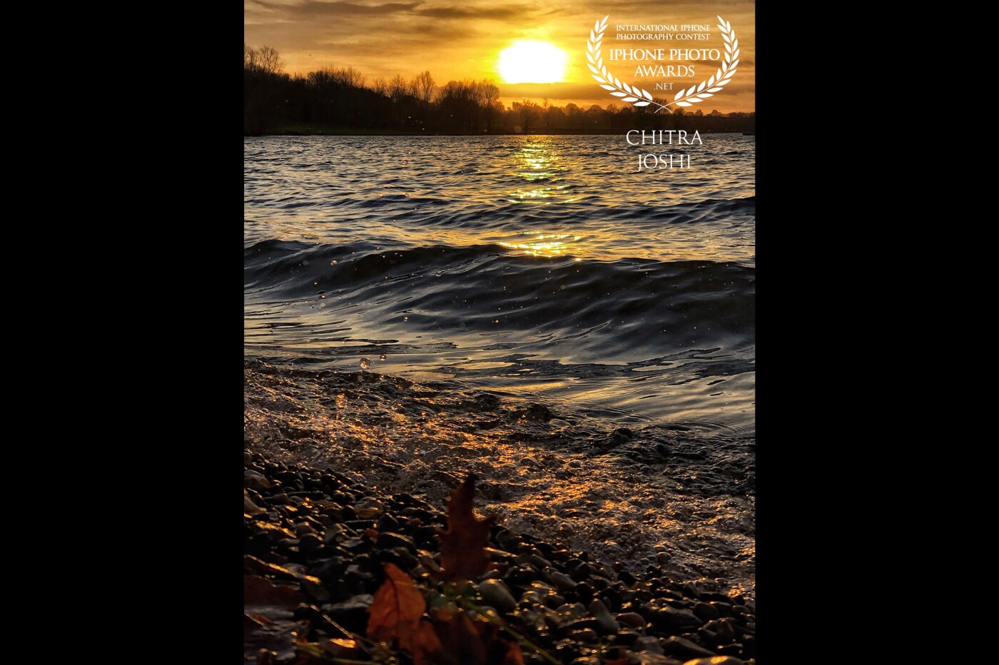 This magnificent golden sunset view was shot at Rutland Water, United Kingdom. A setting sun has always evoked a feeling of happiness and hope in me.  As I watched this radiant sunset at the horizon and the graceful waves, my spirits soared up thinking: Isn’t a “sinking sun” promising of “rising sun” the next day? 