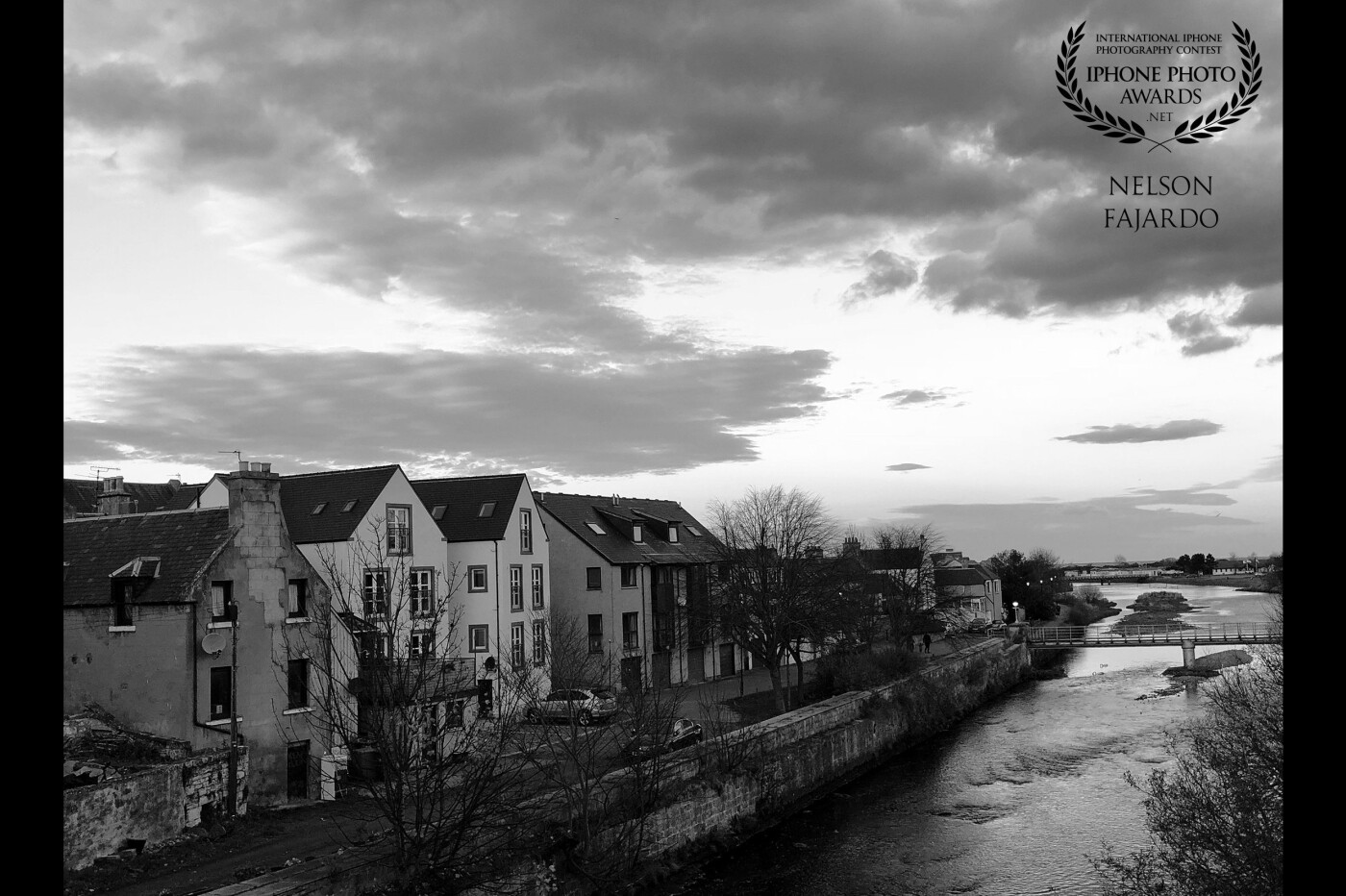 A stroll after dinner with some drizzle by the River Nairn along Harbour street on one autumn late afternoon. I thought it would be nice to put it in black and white for a better compliment of the shot.