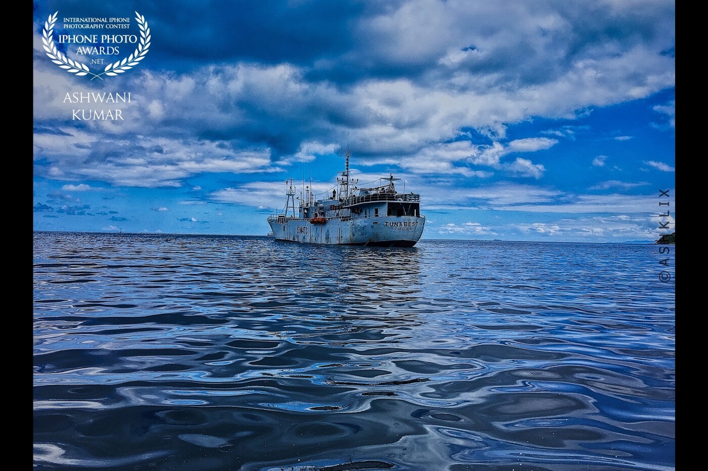 This picture was taken in a small boat during my vacation in Seychelles & I just had my iPhone with me, so I framed the shot very carefully as I wanted to take the shot going close to the water also capturing the cloudy skies & this lone ship. Loved the overall blue feel to this & tried to edit in the same format.