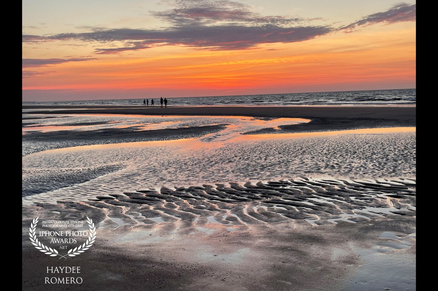 The rising sun at Hilton Head Island in South Carolina creates a ripple of shadows and light on the beach where the constant ebb and flow of the tide has sculpted the sand.