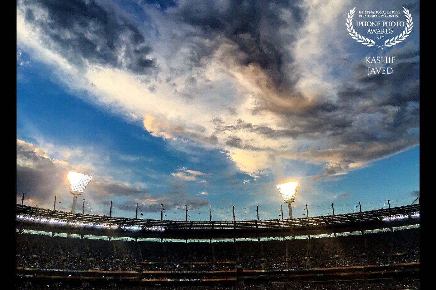 I took this photo while watching a cricket match at iconic Melbourne Cricket Ground (MCG) – Australia. It was just an awe moment spotting this beautiful cloud formation, it gives the impression that MCG is orbiting the earth.<br />
‘Once you are in the orbit of your destiny, weightlessness is the only result.’ — Baba Amte.