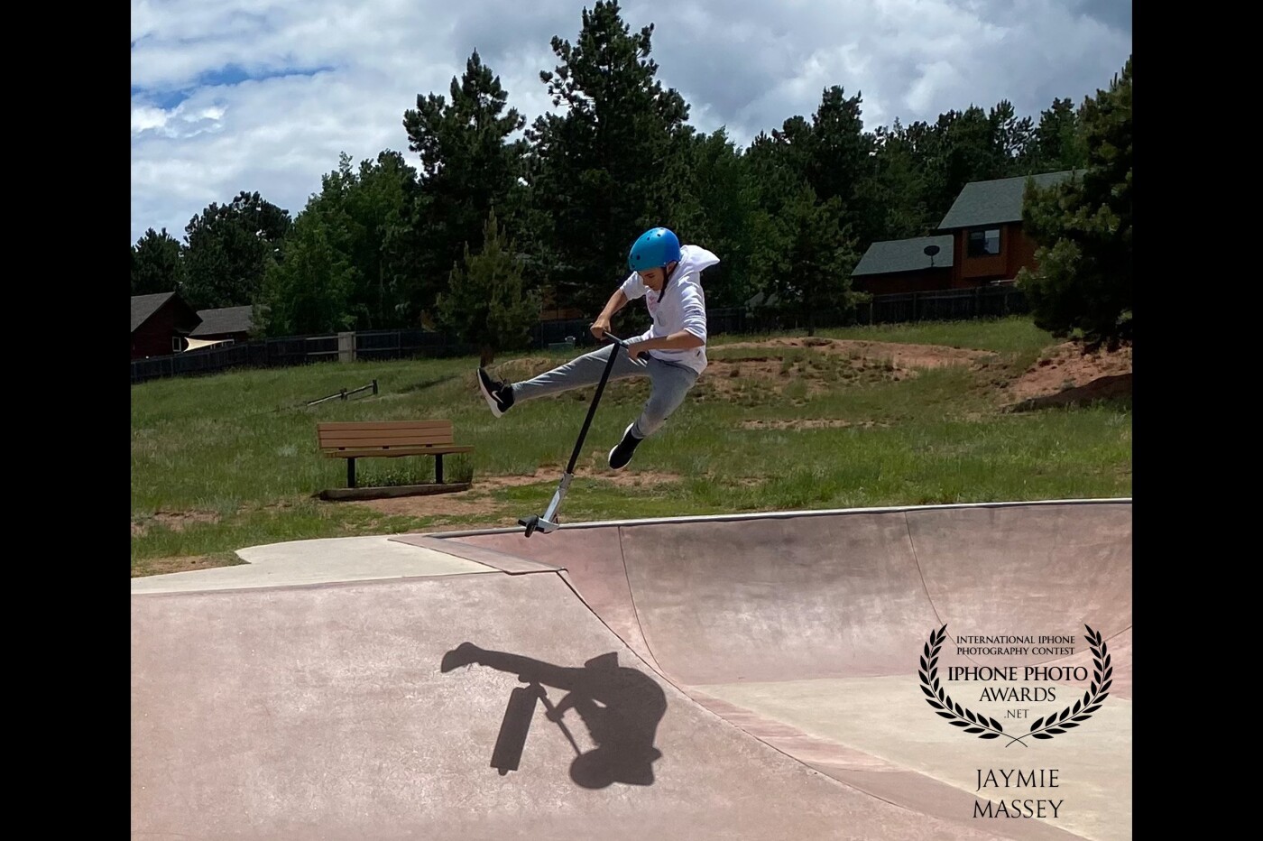 Catching air. Aspiring to be a pro scooter champion means exploring every skatepark in every town to try new tricks. This little skatepark was a favorite stop in Woodland Park, Co.
