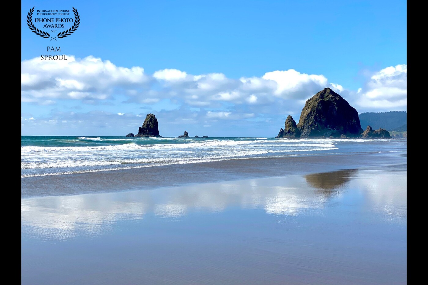 The beautiful layers of color in the water~ the reflection of the clouds in the sand~ grateful to have my iPhone to capture the glory of nature at the beach<br />
Ocean layers -Cannon Beach -2021