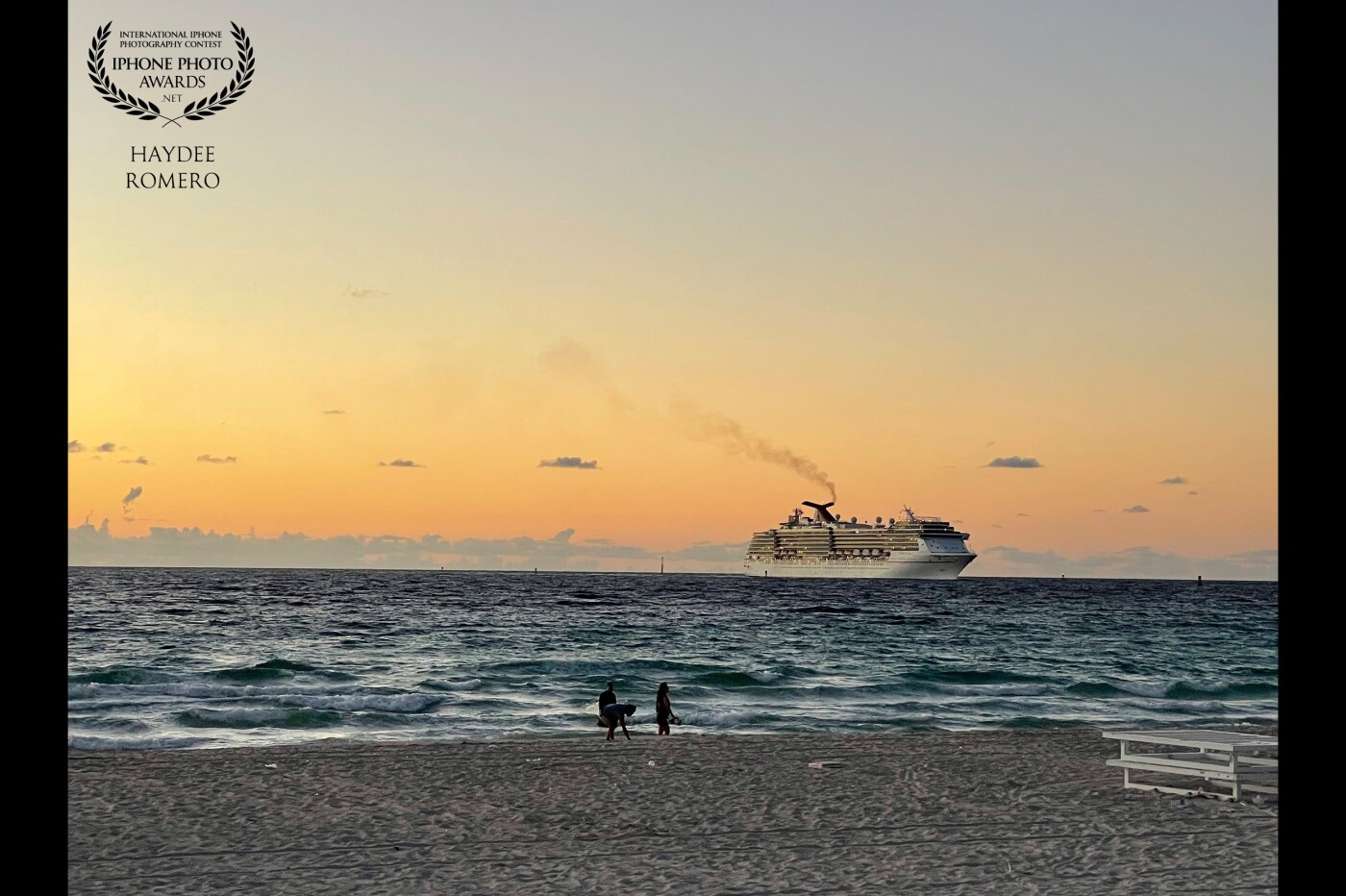 In one of my early walk on the beach I watch a cruise ship makes its way toward harbor as the light of the rising sun glistens on the ocean waters off Miami Beach, Florida.