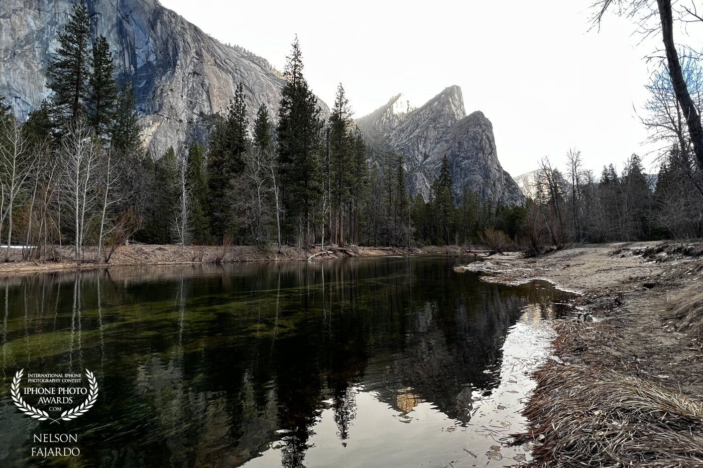 This was taken inside the Yosemite park with (what I call) the bear claw or the three brothers rock with the reflection from the river.