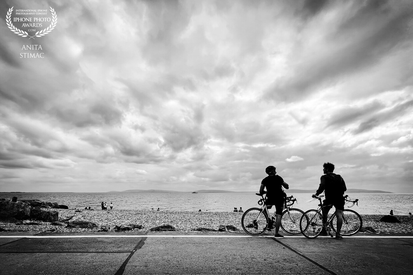 “Whatever the clouds plan to do, I always trust in the sun which never fails to come out.”<br />
<br />
Salthill Promenade in Galway, West Coast of Ireland.  The Road by the sea facing the immensity of the Atlantic Ocean.