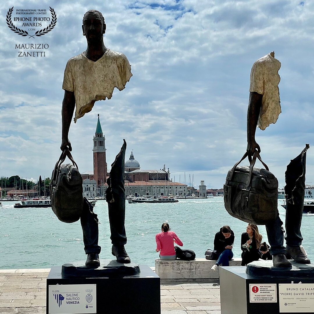 Two sculptures by the artist Bruno Catalano in Venice, along the Riva degli Schiavoni. Its "suspended statues" placed in a strategic position give new framing to the splendid island of San Giorgio.