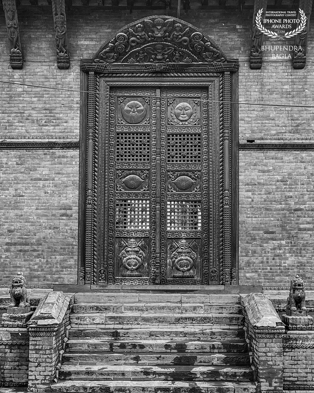 This was shot at the most famous temple in Kathmandu, Nepal. The staircase and the beautiful gigantic wooden door captured my eye and made a very good frame for photographing it. I converted it into black and white to add more vintage and raw look to the whole photograph.