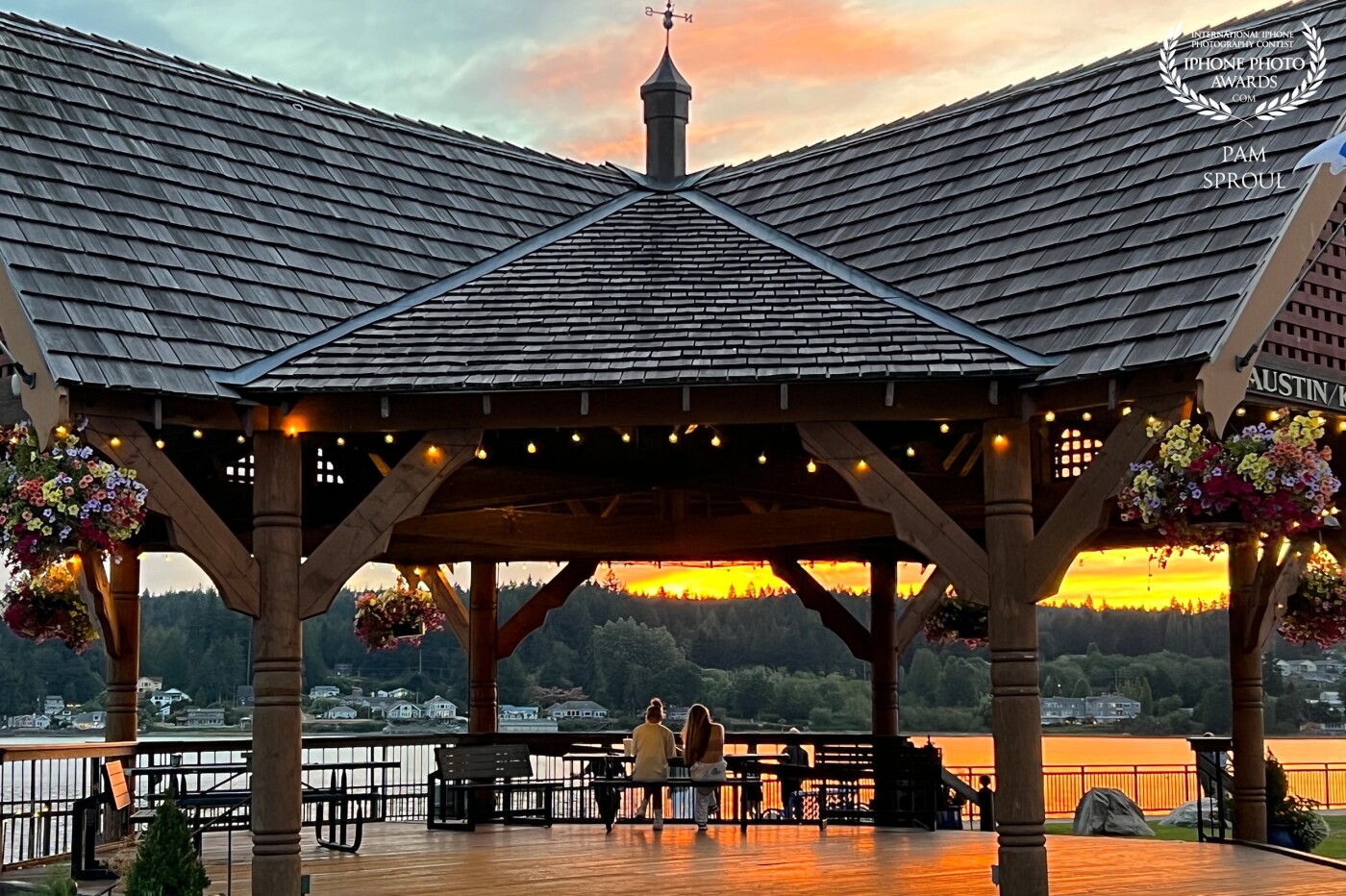 Golden light on Liberty Bays beautiful gazebo. The people framed in the shot were unexpected and added so much to the shot. My iPhone allows me the spontaneity to capture these special moments. Grateful <br />
<br />
#GoldenGazebo 2022