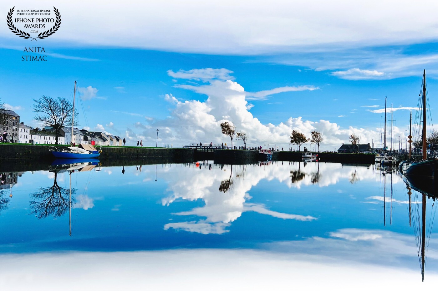 “How sweet to be a Cloud Floating in the Blue! Every little cloud Always sings aloud.”<br />
<br />
Cloud Reflection at Claddagh Basin, Galway City, Ireland.