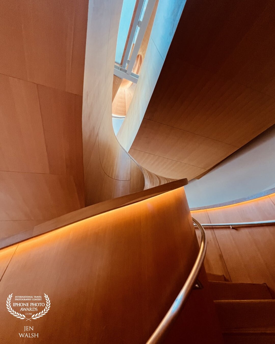 An abstract view of the iconic Frank Gehry - designed spiral staircase at the Art Gallery of Ontario. It is one of the most distinctive architectural features in all of Toronto.