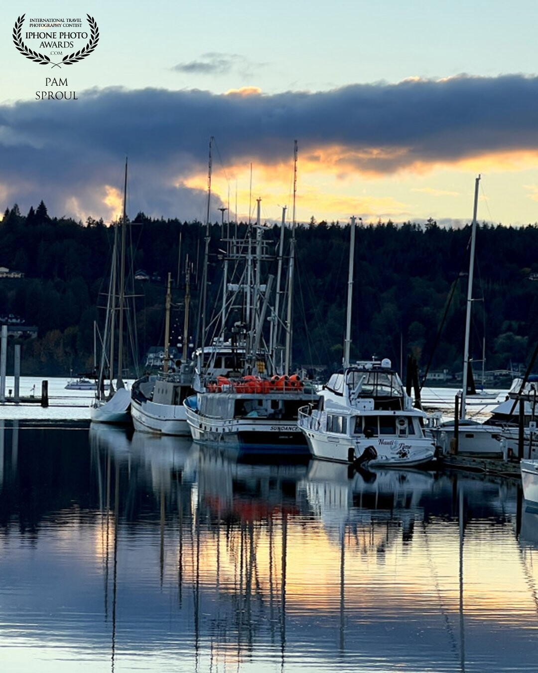 Took a chance and went down to the harbor hoping that the sky was developing and turned to my right and saw these beautiful boats sitting amidst the reflections of the sky ~ day made <br />
#liberty bay harbor sky -2022