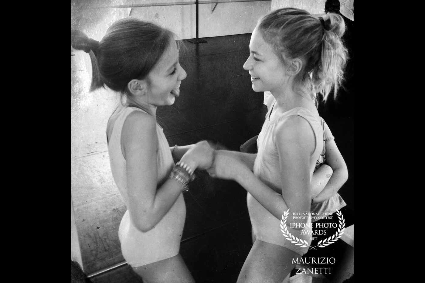 Dance is art but also play, friendships that are born and grow over the years. The backstage is the best place to find out. Picture taken with iPhone, no post production except the transition from color to black and white.