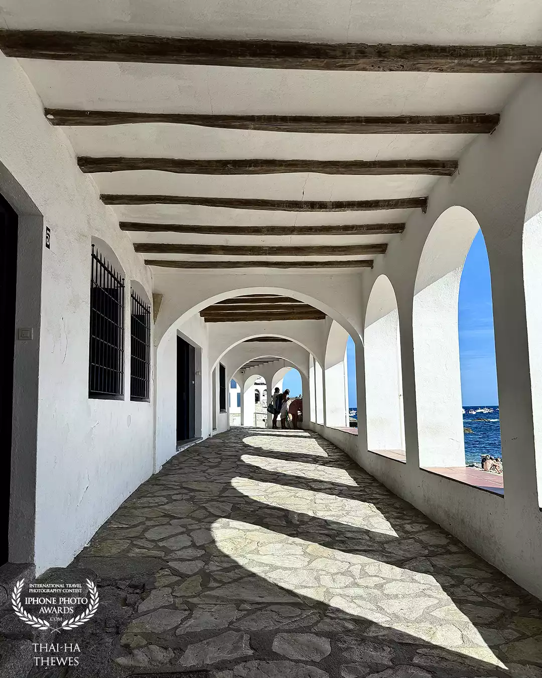 Beautiful maritime passageway at the beach Platja de Port Bo in Calella de Palafrugell, Costa Brava, Spain.