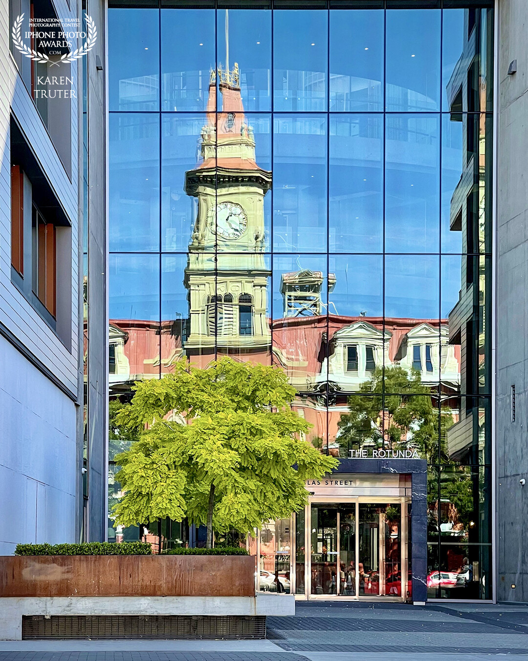 My husband and I were sat at a red stop light beside the Old City Hall, Victoria, British Columbia and across the street was this wonderful reflection in the window of the modern building. I love the juxtaposition of the old and new in this capture.