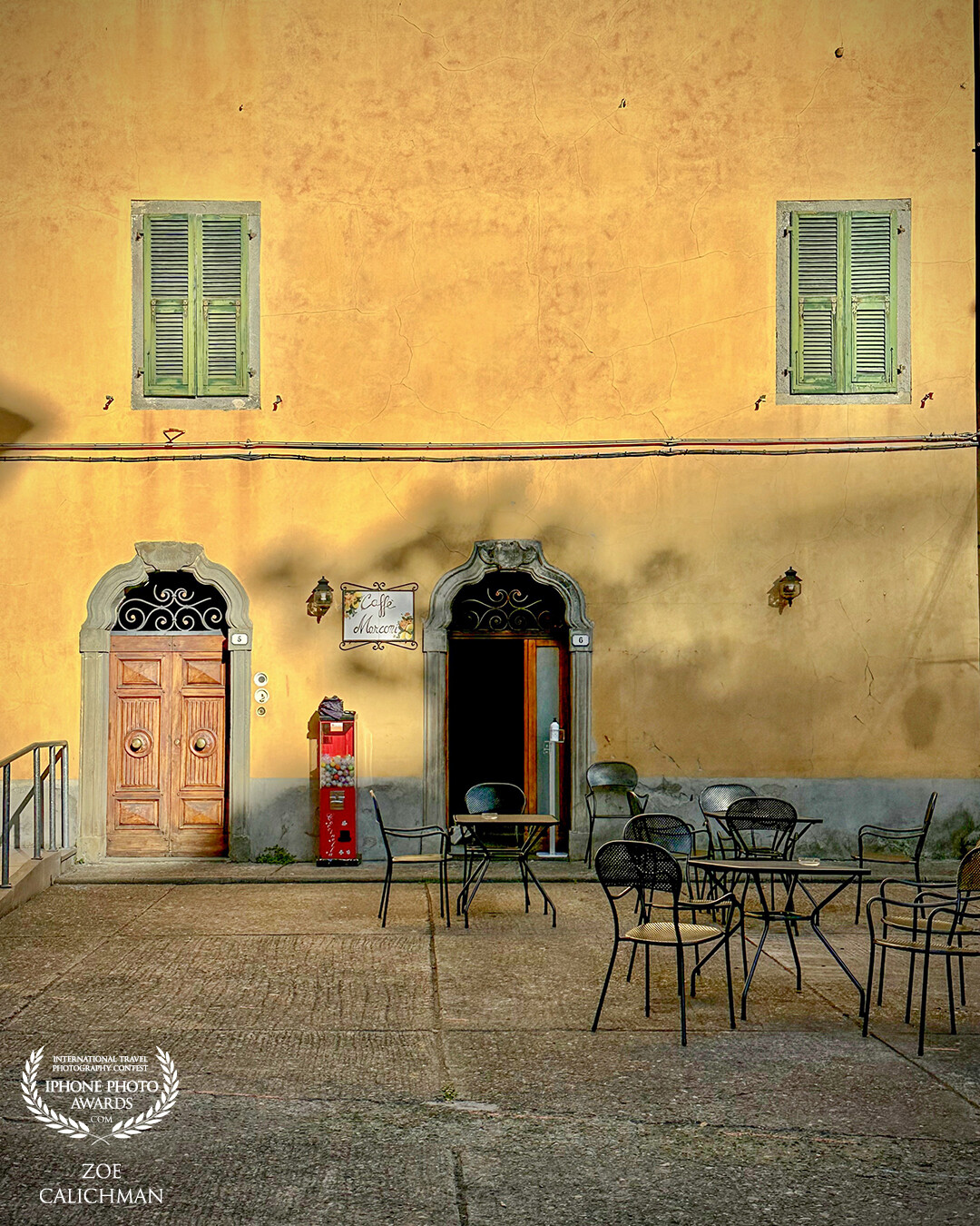 A lazy afternoon stroll in one of the small Tuscany villages. Empty outdoor cafe with casting sun depicts a perfect charming Italy.