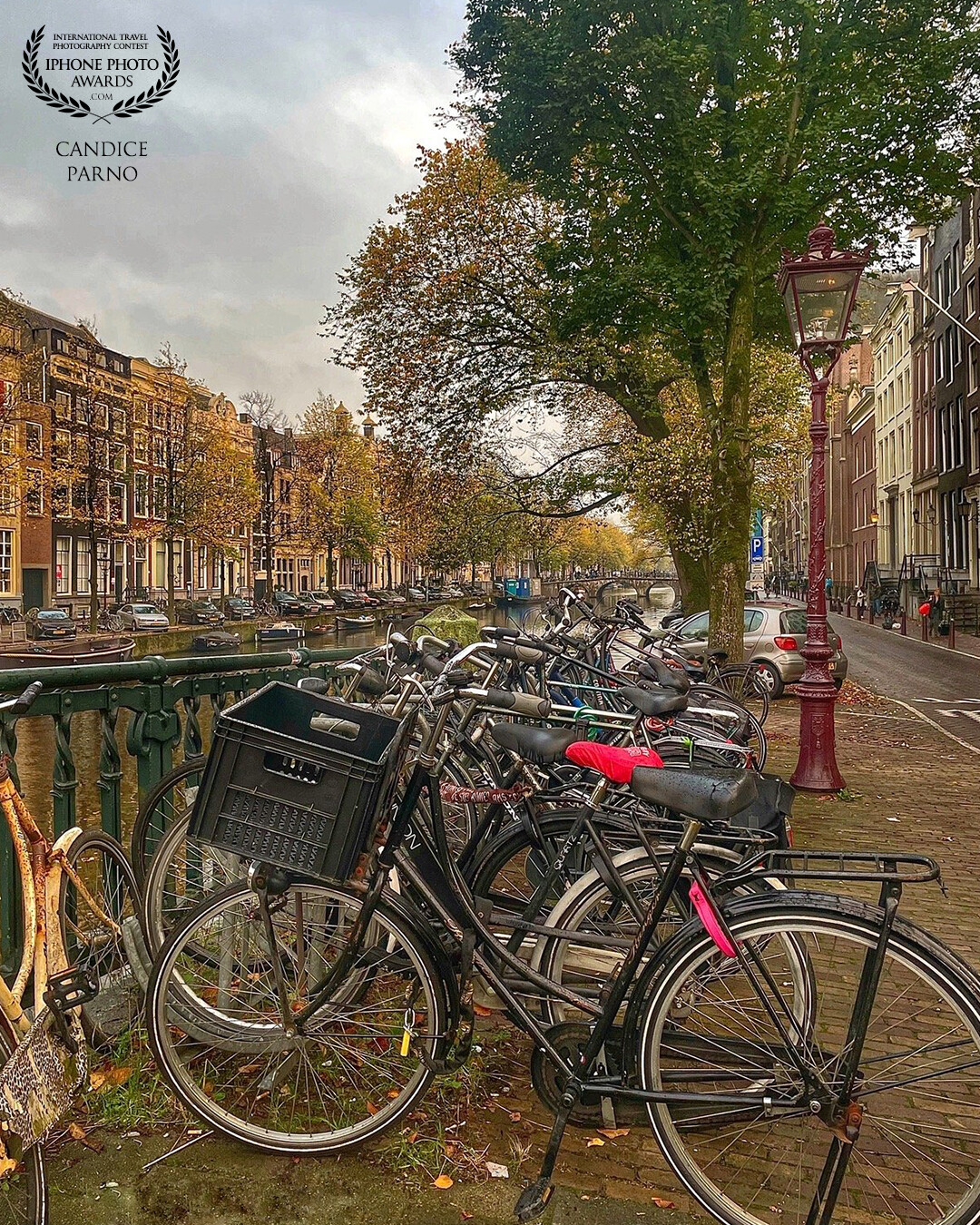 On my first trip to Amsterdam I was in constant awe of the number of bicycles everywhere.  This is just one of many photos of the iconic Amsterdam River and bicycles I took on that trip.