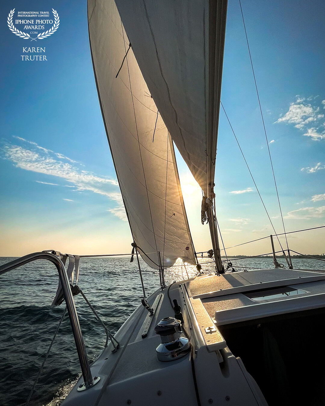 Lake Ontario, Canada. It was a sultry evening with very little wind, then, suddenly the wind picked up; our master sailor turned the boat and the sails filled like lungs breathing fresh air and we sailed into the sunset.