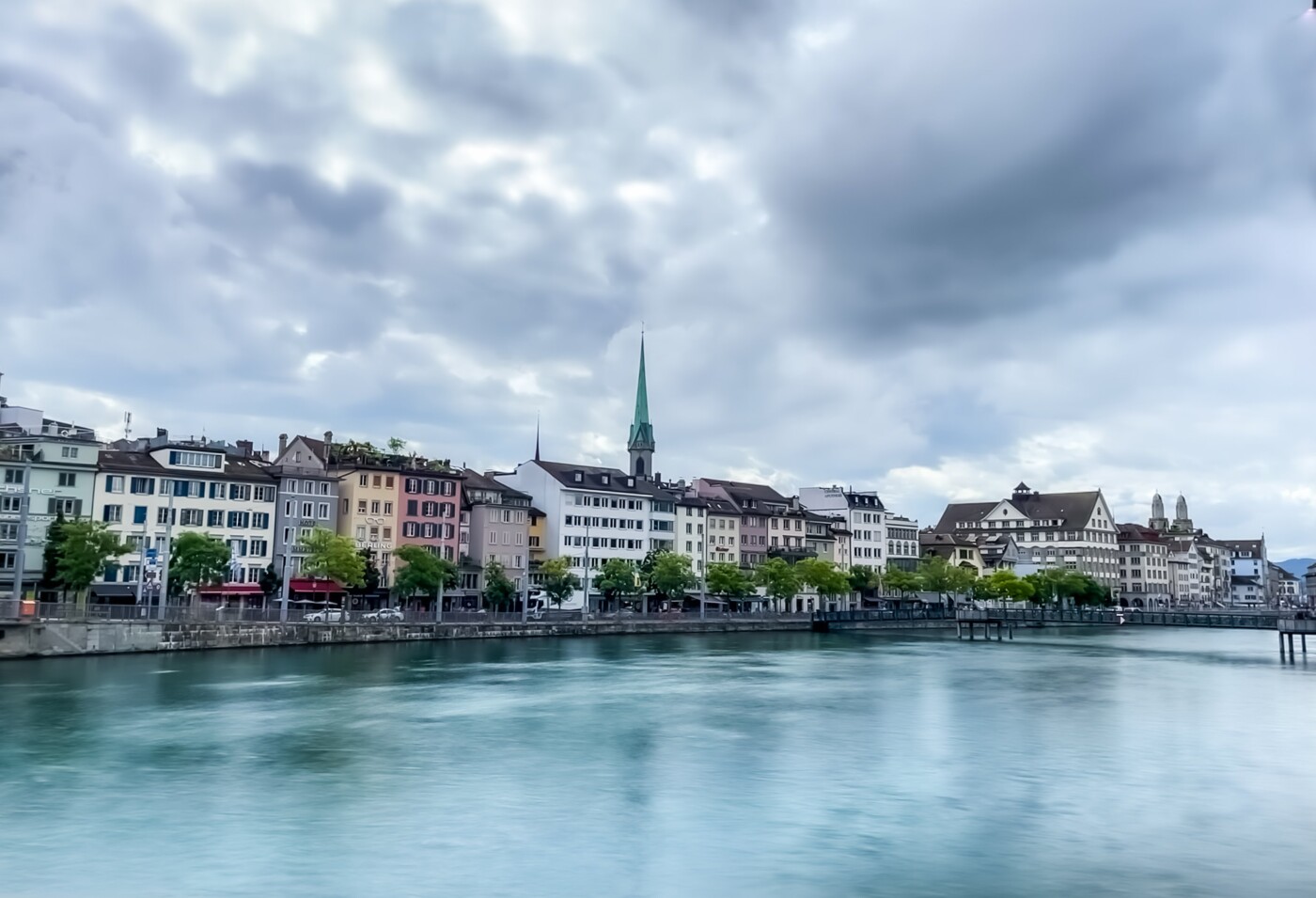 Even on a cloudy day the city of Zurich is beautiful. In this image the river Limmat is shown. It’s...