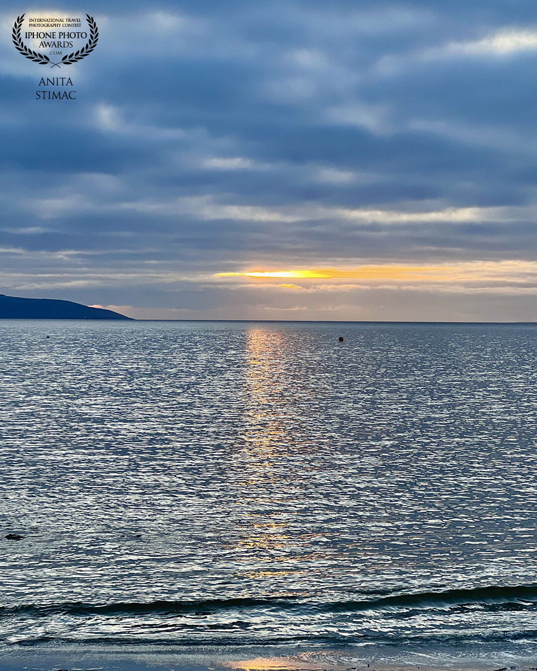 Sunset on Salthill: Blue sea and sky meet the golden glow of the sun. Captured in Galway.